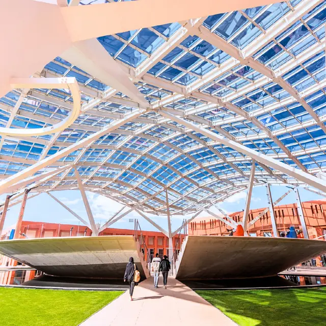 The glass canopy and terracotta buildings of the UM6P campus in Ben Guerir